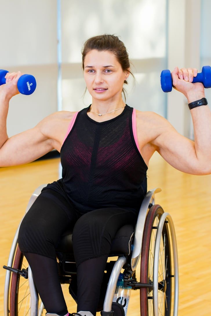 Woman in wheelchair exercising
